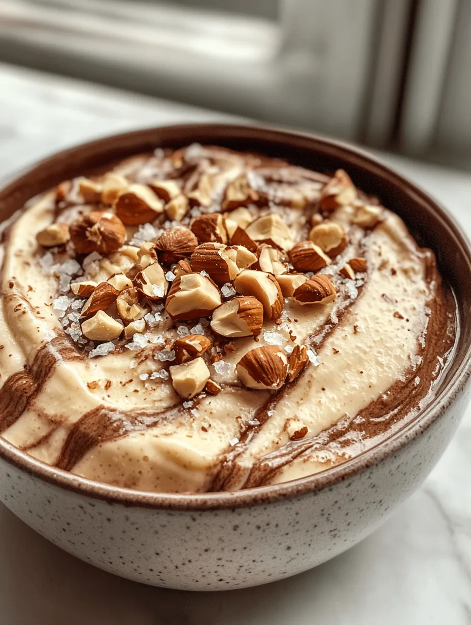 The Toasted Milk Marble Dessert is a delightful culinary creation that beautifully marries rich, creamy textures with the robust flavors of toasted milk, chocolate, and hazelnuts. This dessert not only captivates the palate but also the senses, presenting an exquisite layering of flavors that is both indulgent and comforting. Imagine sinking your spoon into a silky, smooth dessert that offers a unique interplay between the sweet nuttiness of toasted milk and the deep, dark notes of chocolate. Each bite is a journey, from the initial creamy sweetness to the lingering nutty finish, making it a perfect treat for special occasions or a cozy night in.