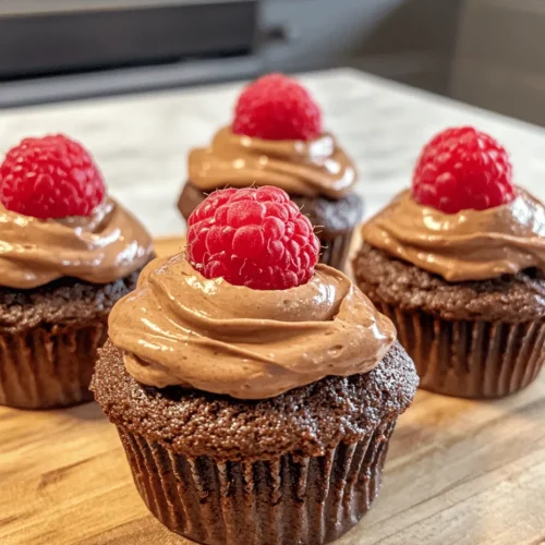 Cupcakes have taken the dessert world by storm, offering a delightful blend of flavor, texture, and presentation all in one small package. Among the myriad of flavors available, the chocolate raspberry combination stands out as a beloved choice for many dessert enthusiasts. The pairing of rich, decadent chocolate with the tartness of fresh raspberries creates a balanced profile that tantalizes the taste buds. When you add a luscious filling of Nutella, a favorite hazelnut spread known for its creamy texture and chocolatey goodness, the result is a cupcake that is not just a treat but a true indulgence.