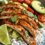 The Honey Lime Chicken & Avocado Rice Stack is inspired by a fusion of Mexican and Asian flavors. The sweetness of honey is a staple in many Asian dishes, while lime is a quintessential ingredient in Mexican cuisine. This recipe brings the best of both worlds together, introducing a delightful play on flavors that is sure to become a favorite in your household. Its versatility makes it ideal for various occasions, whether you're hosting a family dinner, preparing meal prep for the week, or impressing guests at a summer barbecue.