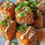 Crispy Bang Bang Salmon Bites are an irresistible blend of flavors and textures that have taken the culinary world by storm. This dish brings together the rich, buttery taste of salmon, a crispy coating, and a zesty, creamy sauce that ignites the palate. Perfect as an appetizer for gatherings or as a satisfying main course for a cozy dinner at home, these salmon bites are not just a meal but an experience. The delightful crunch from the coating combined with the spicy, tangy Bang Bang sauce makes this dish a crowd-pleaser, sure to impress family and friends alike.